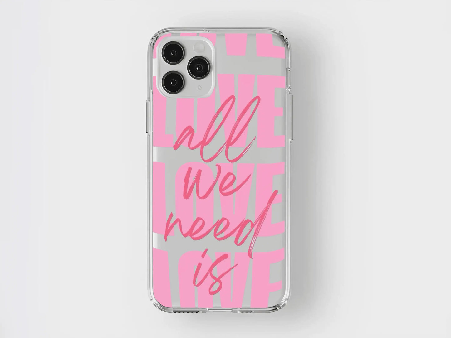 Şeffaf, pembe yazılı, 'all we need is love' temalı iPhone kılıfı