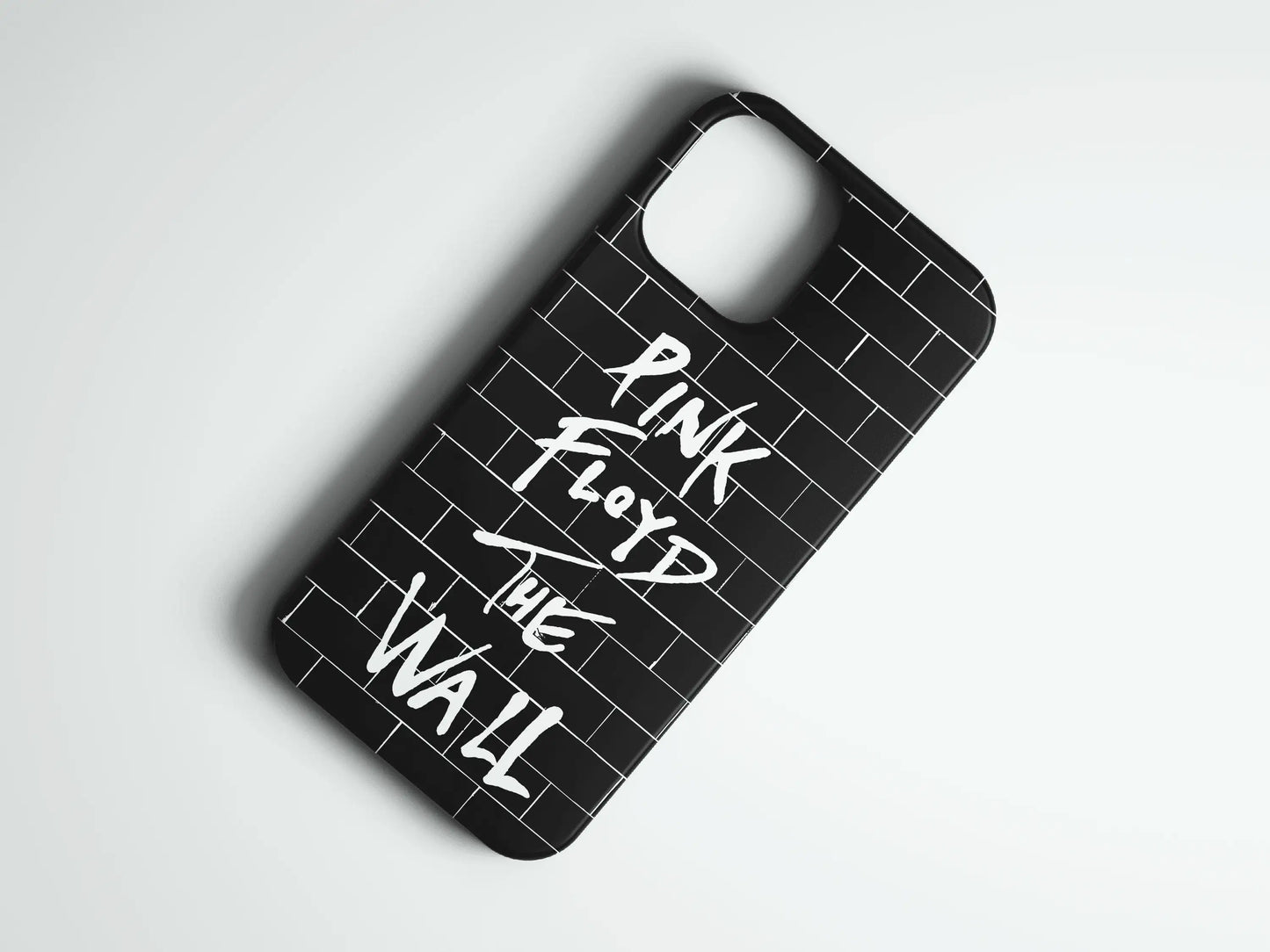 Siyah tuğla desenli, üzerinde beyaz 'Pink Floyd The Wall' yazılı telefon kılıfı