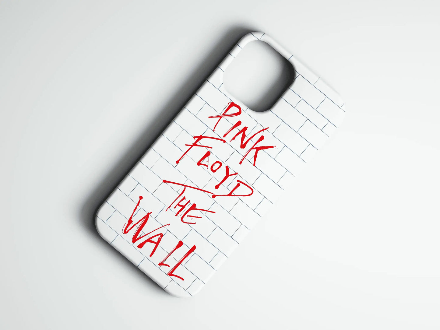 Beyaz tuğla desenli, kırmızı yazılı The Wall temalı telefon kılıfı